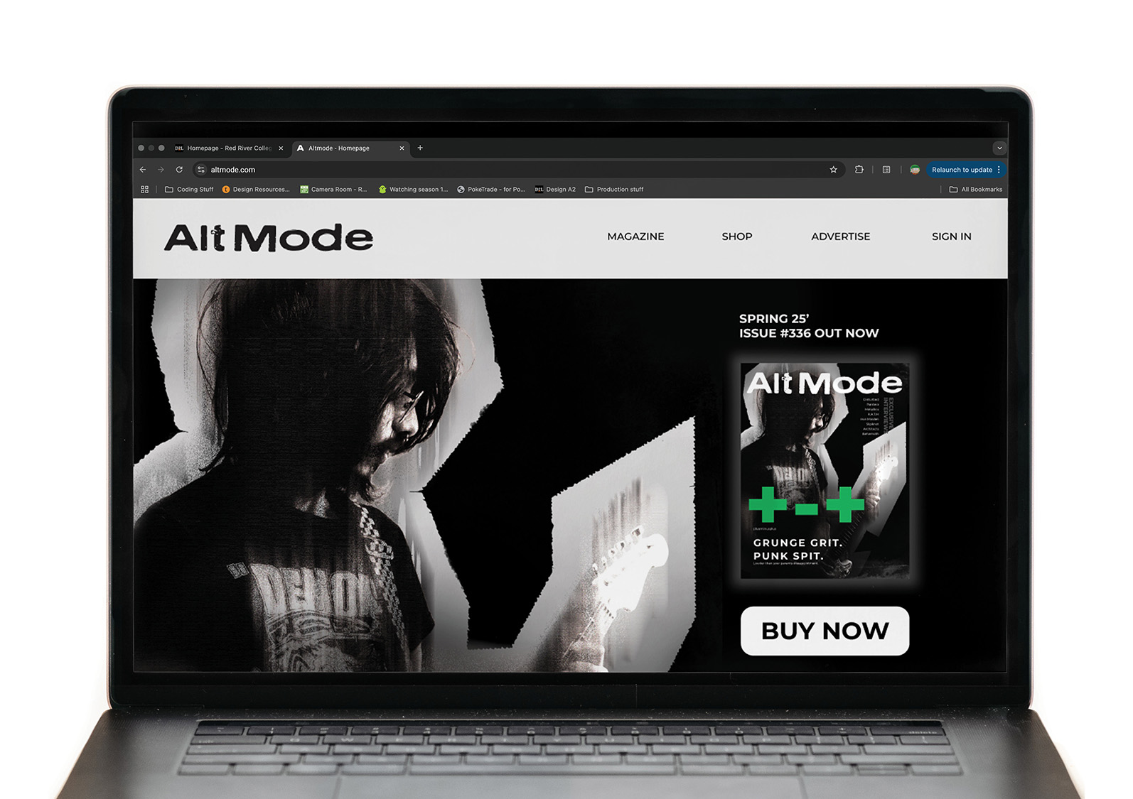 A laptop displays the AltMode website homepage. The site features a black and white image of a person with dark hair and a t-shirt, alongside a magazine cover promoting the Spring '25 issue with the tagline 'Grunge. Grit. Punk Spit.' With a 'Buy Now' button underneath.